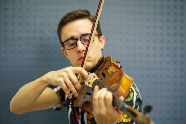 istock Musician playing violin with Pizzicato technique 1182843088