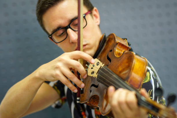 istock Musician playing violin with Pizzicato technique 1182843107