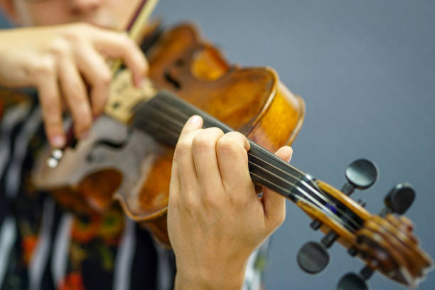 istock Musician playing violin with Pizzicato technique 1182843162