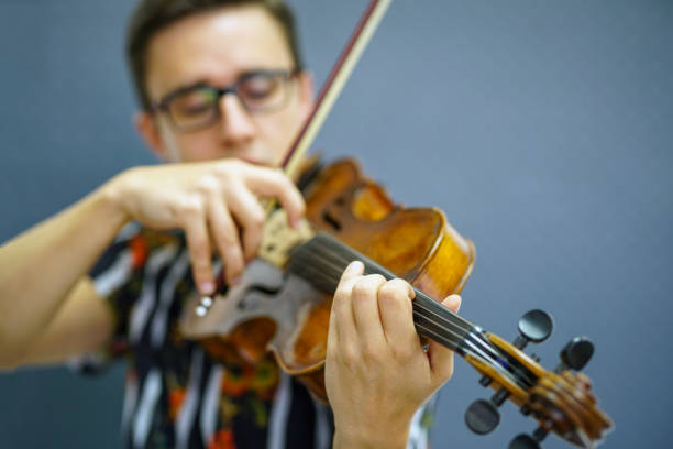 istock Musician playing violin with Pizzicato technique 1182843226