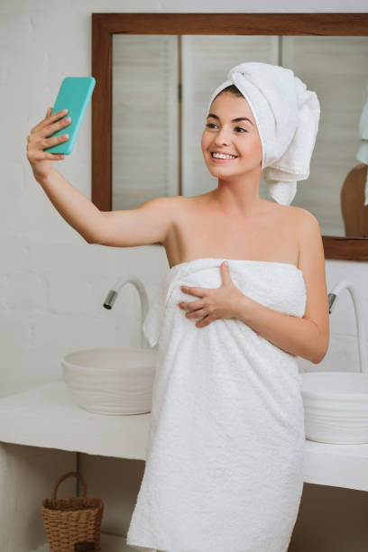 istock woman taking selfie on smartphone 1182844086