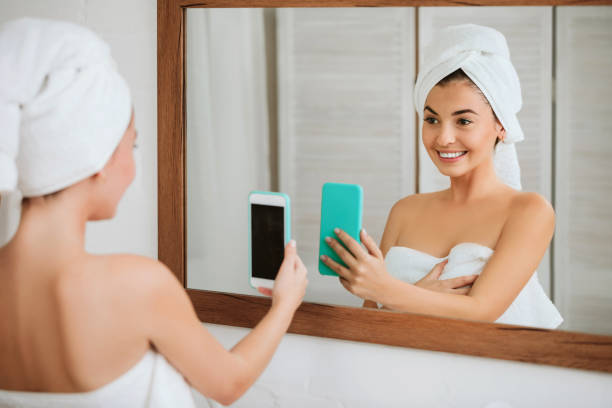 istock woman taking selfie on smartphone 1182844096