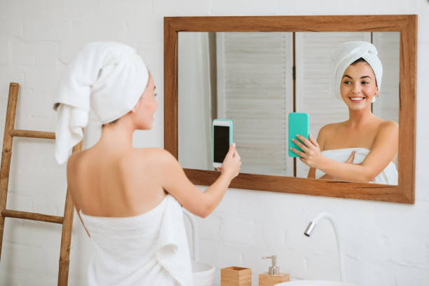 istock woman taking selfie on smartphone 1182844139