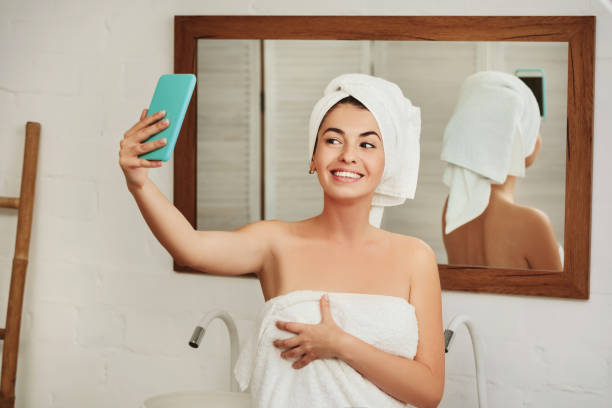 istock woman taking selfie on smartphone 1182844654