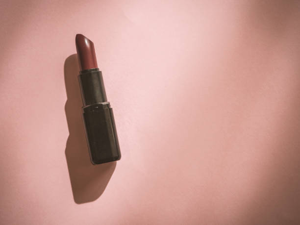 istock Woman lipstick on pink background with copy space 1182844825