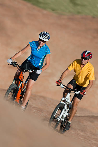 istock Bicyclists Riding Mountain Bikes Near Moab, Utah 118284531