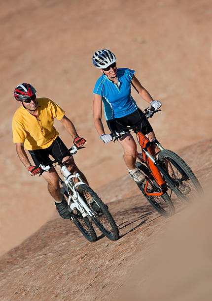 istock Two Cyclists Riding Mountain Bikes On Rugged Terrain 118284588