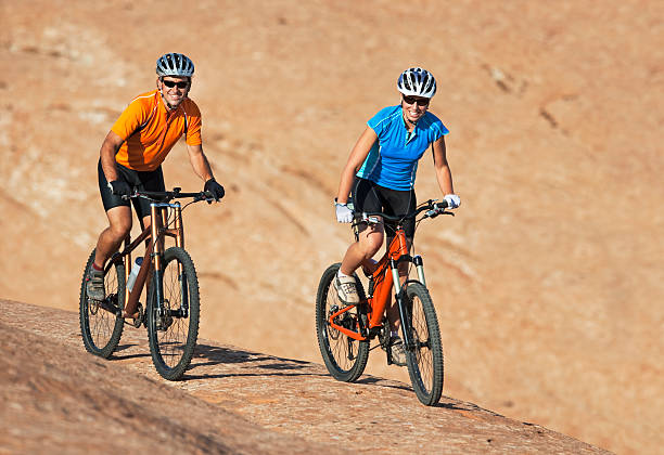 istock Two Athletes Riding Mountain Bikes on Slickrock Trail 118284590