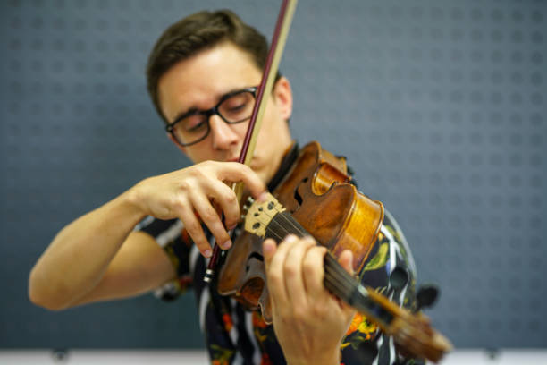istock Musician playing violin with Pizzicato technique 1182847210