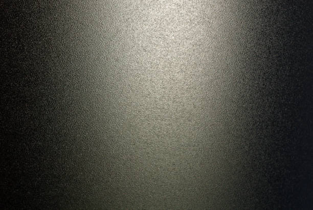 Ground glass texture in black color with light.