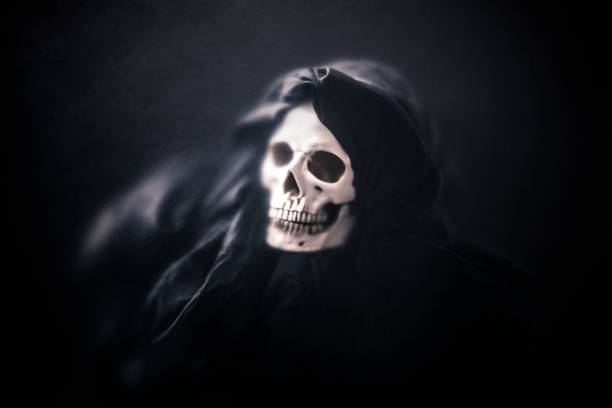 The grim reaper with a cloudy blue sky background