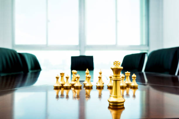 istock Golden pieces on the conference table 1182849237