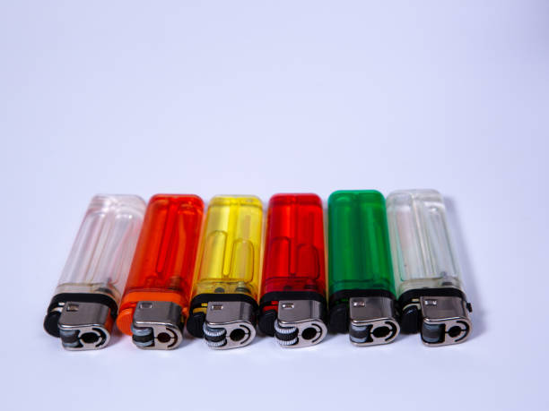 istock six lighters in different colors lying on white underground 1182849948
