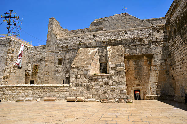 Selected photos from Manger Square in Bethlehem, the Cradle of Christ, showing the Church of the Nativity and the Christmas Tree on Christmas Eve for the Eastern sects, showing the details and walls of the adjacent houses, the balconies and the Omar Bin Mosque, the pendant lighting, and the beautiful decor. Around the place.