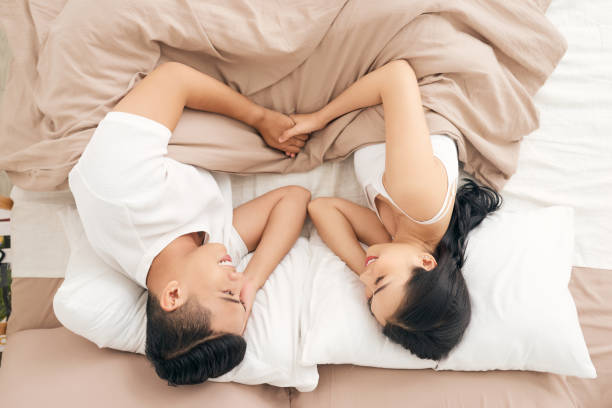 istock Young loving couple in the bed 1182854254