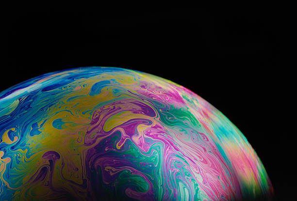 istock Isolated shot of multicolored soap bubble on black background 118285538
