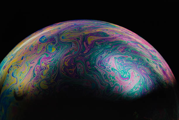 istock Isolated shot of multicolored soap bubble on black background 118285601