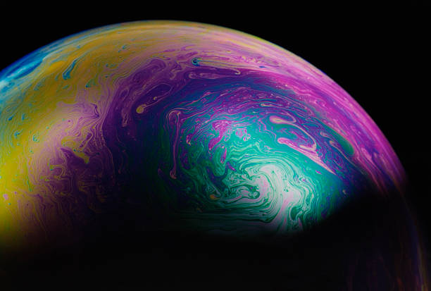 istock Isolated shot of multicolored soap bubble on black background 118285602
