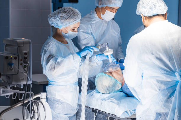 Pre oxygenation for general anesthesia. Surgery equipment Team of experienced doctors and assistants performing difficult abdominal surgery, using the chance to save patient s life, and there is no greater calling in the world than that. medical oxygen stock pictures, royalty-free photos & images
