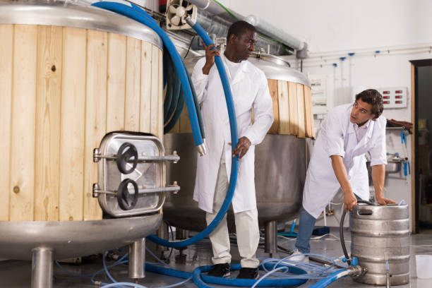 istock Brewers working on his workplace in the brew-house 1182858013