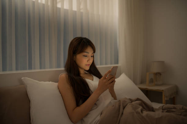 istock Young woman read message on cellphone 1182858428