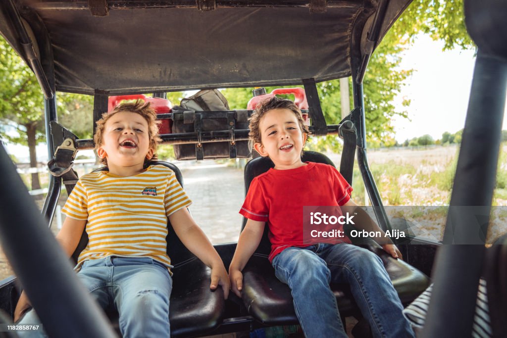 Boys having fun at a pickup truck in a Ranch Boys having fun at a pickup truck in a Ranch in Mexico Child Stock Photo Boys having fun at a pickup truck in a Ranch Boys having fun at a pickup truck in a Ranch in Mexico Child Stock Photo