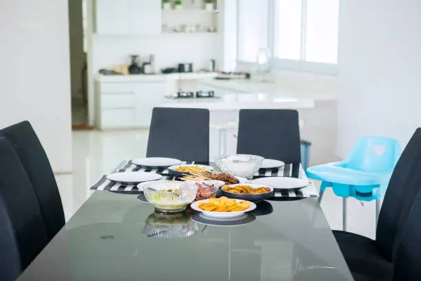 Image of dining table served with various foods to lunch at home