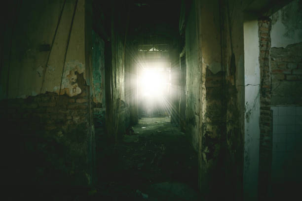 istock Empty corridor toward sunlight in a spooky house 1182858893