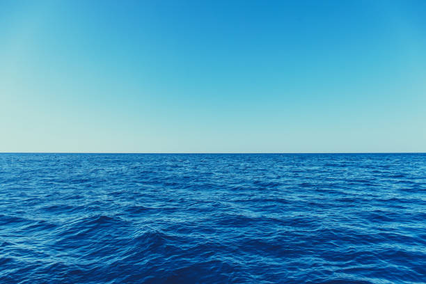 istock Blue sea surface with waves and horizon 1182860352