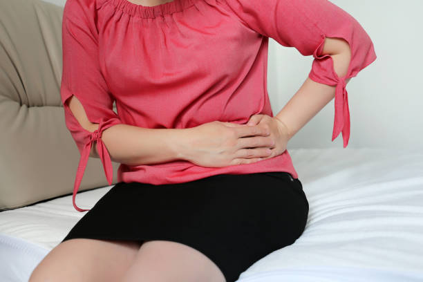 istock Woman suffering from pain in the side 1182862082