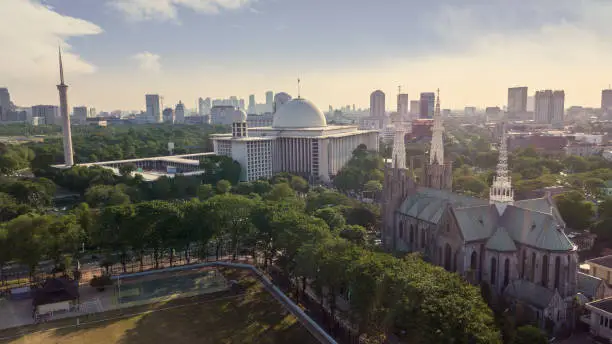 JAKARTA - Indonesia. October 11, 2019: Aerial view of Cathedral Church and Istiqlal mosque in Jakarta city, Indonesia