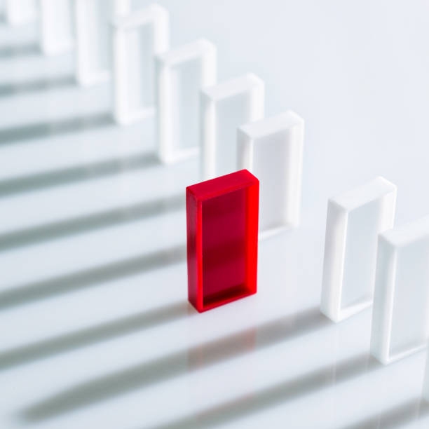 istock The red domino stands out 1182863663