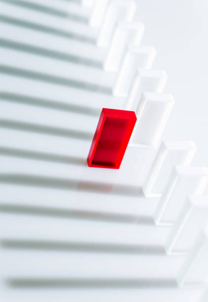 istock The red domino stands out 1182863666