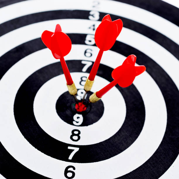 istock Three red darts arrows in the target center 1182863961