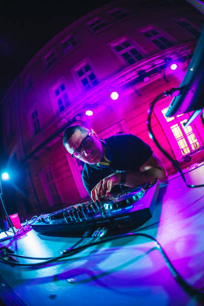 istock DJ playing and mixing music at party 1182869288