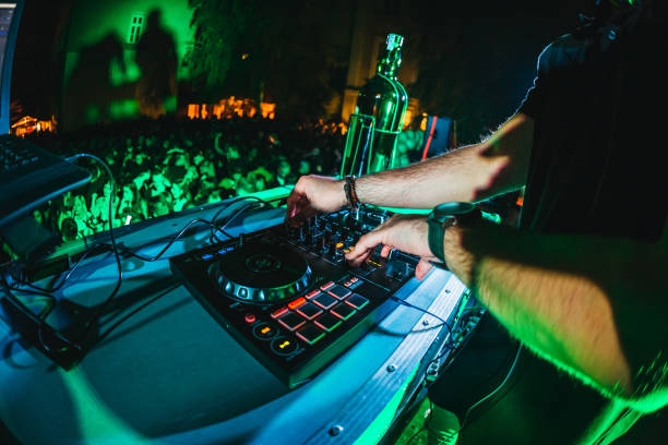 istock DJ playing and mixing music at party 1182869324
