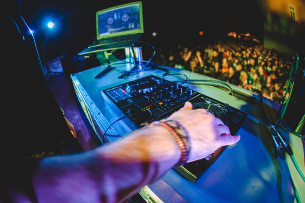 istock DJ playing and mixing music at party 1182870011