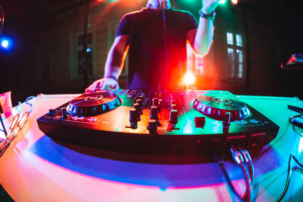 istock DJ playing and mixing music at party 1182870102