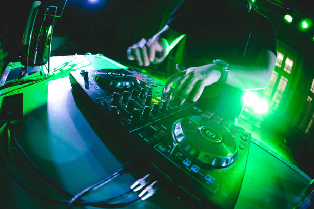 istock DJ playing and mixing music at party 1182870121
