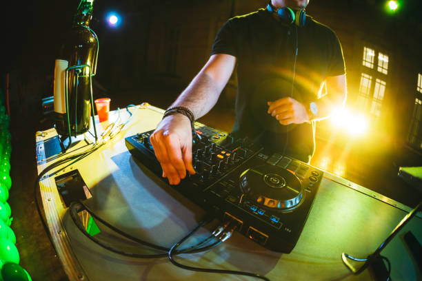 istock DJ playing and mixing music at party 1182870199