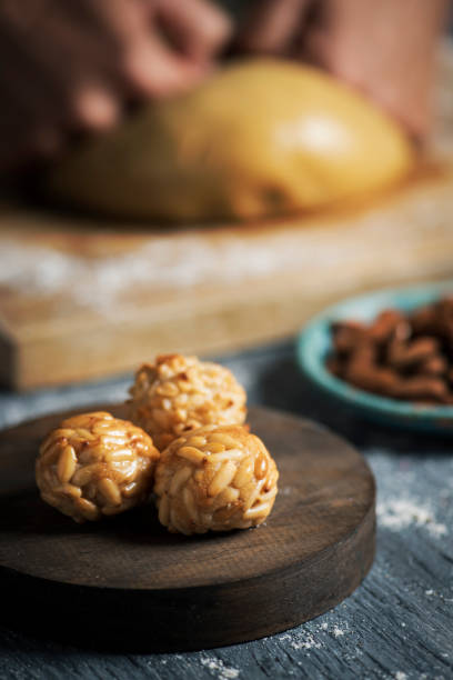 istock man preparing panellets, typical of Catalonia 1182871961