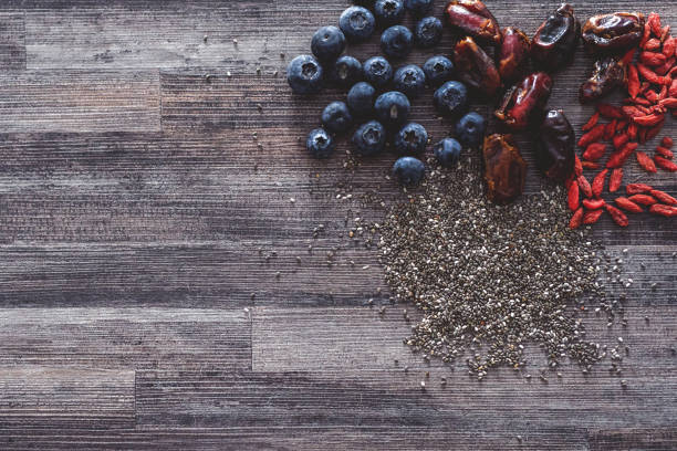 Shot of a bunch of super foods laying on a wooden background