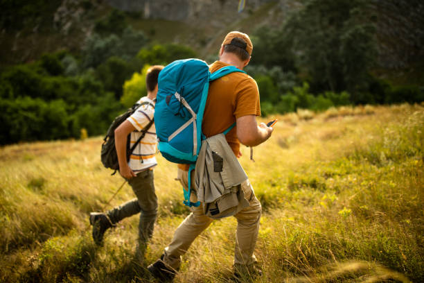 istock Beautiful sunny day in mountains with dad 1182878241