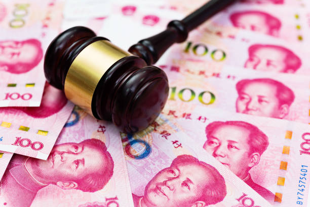 istock Group of Chinese yuan note and gavel 1182879140