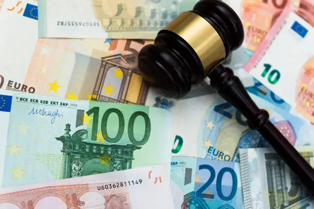 Photo of Euros bills and gavel