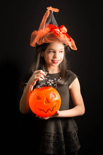 istock halloween costume girl 1182880460