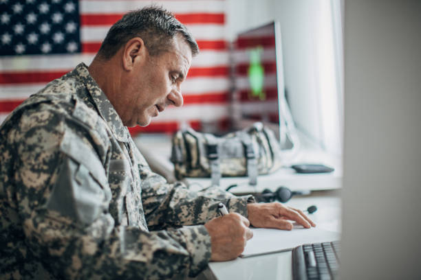 istock Solider writing on paper in the office 1182883373