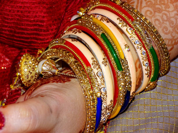 istock Pretty lady wearing beautiful bangles during traditional ceremony 1182883457