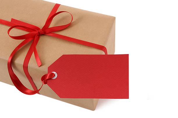 istock Brown paper package with red ribbon and tag 118288497