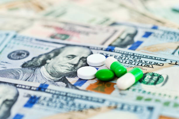 istock Some pills on US dollar bills 1182889305